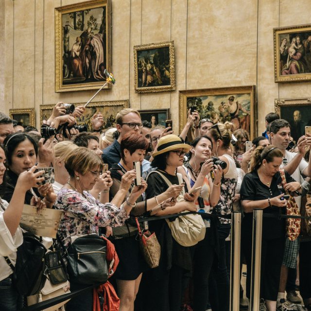 Tourists in the Louvre Museum Paris